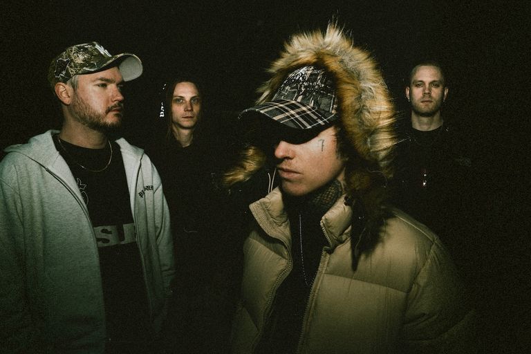 Swedish metalcore band Thrown posing in dark streetwear for a promotional band photo taken by Emil Engvall.